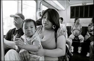 Young mom with baby on Metro Transit bus, black and white photo