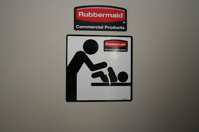 Classic international symbols. Baby's arms are raised as if to defend from the parent, bending over with arms raised also