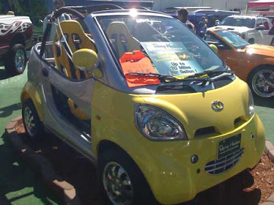 Yellow futuristic-looking mini car