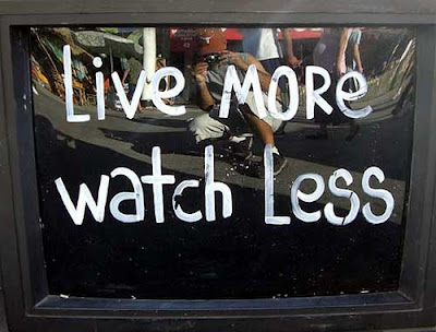 TV screen painted with the words Live More, Watch Less