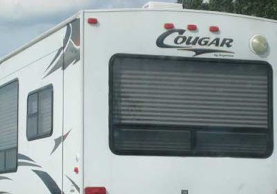 Back of an RV with large logo reading Cougar