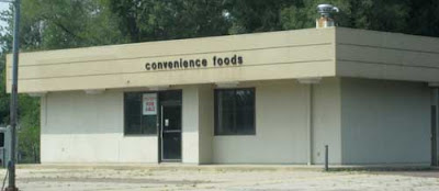 Beige rectangular building with small sign reading Convenience Foods