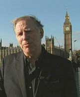 Photo of T.R. Reid in front of the British Houses of Parliament