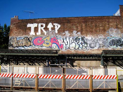 Graffiti on wall above construction
