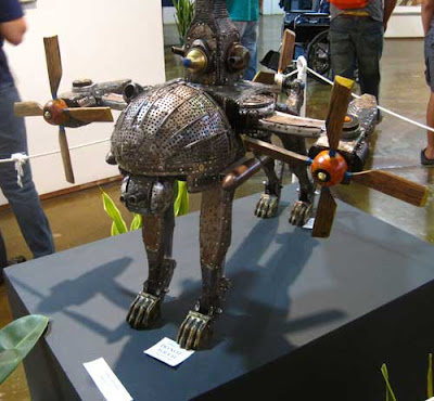 Metal and wood dog with head made of vegetable steamers