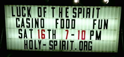 Lit temporary sign reading Luck of the Spirit - Casino - Food - Fun