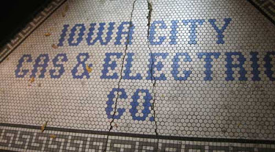 Iowa City Gas & Electric name in dime tile floor outside a door