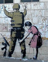 Palestinian girl frisking Israeli soldier--Grafiti on the terrorist wall dividing Israel/West Bank