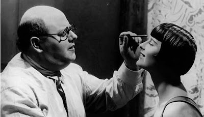 Louise Brooks gets her eye makeup applied