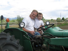 Two of Tyson's favorite things...Papa and tractors!