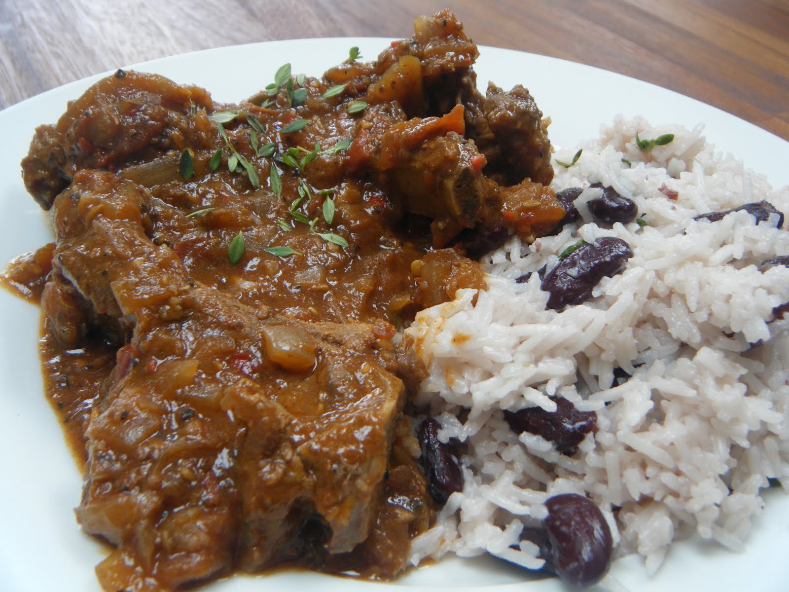 Chicken in a Cherry Sauce Goat curry with rice and peas