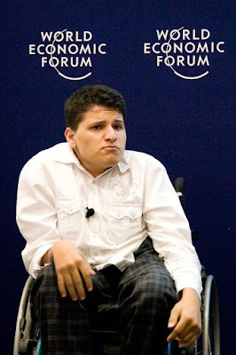 Musa, a young man in a wheelchair, pulling a face during his rap