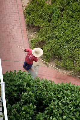 View of person sweeping from above