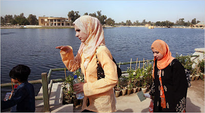 Women walk through Baghdad's Zawra Park. Joao Silva for The New York Times