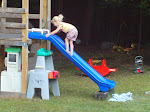 Kath climbing UP the slide!!