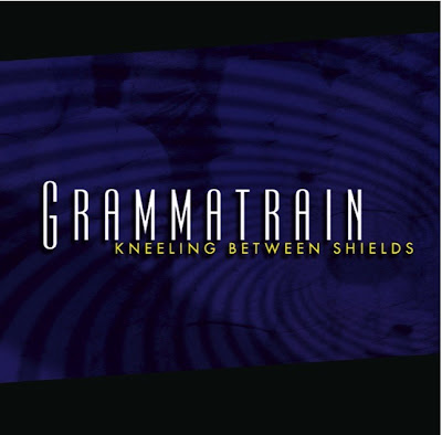 Grammatrain - Kneeling Between Shields [EP] (2009)