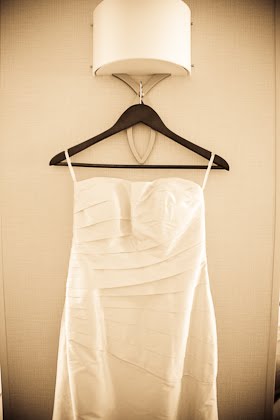 Wedding dress hanging under light at Courtyard Marriott in downtown Chicago