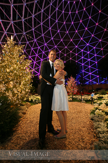 Portrait of bride and groom in Milwaukee Domes with purple lights