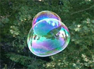 Thin film interference demonstrated with soap bubbles.