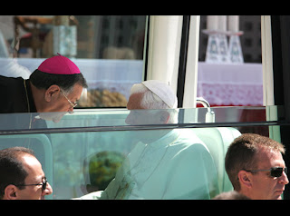 Pope Benedict XVI speaking to the Latin Patriarch of Jerusalem Fouad Twal inside the Pope mobile car image