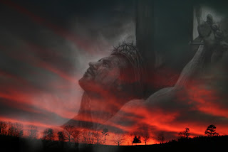 Jesus Christ on the Cross in the sky looking on the sunset background photo