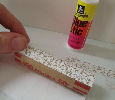 Patterned paper being applied on to coin rolls