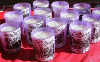 Candles with Stations of the Cross labels