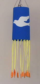 Blue windsock with dove on it and yellow and red streamer