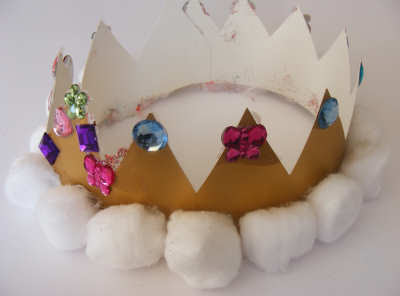 Construction Paper Crown with stickers, gems, and cotton balls