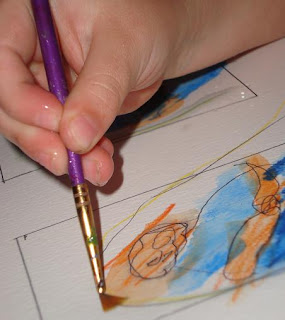 Hand with paintbrush painting trading card