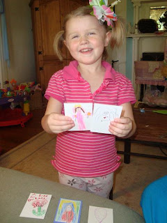 Lydia displaying her Catholic trading cards.