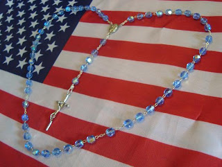 Rosary in Heart Shape on Flag