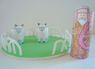 Shepherd and sheep standees in craft pasture