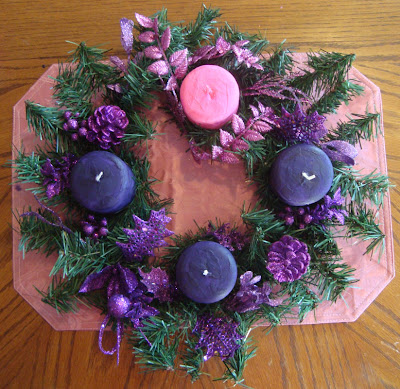 Candle wreath with pink and purple candles