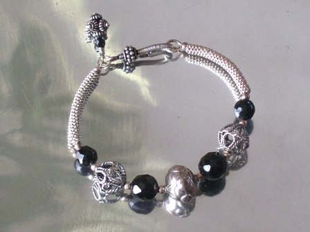 Black faceted and bali silver bead cuff bracelet - $54