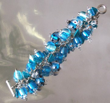 A jumble of turqoise and silver toned bead bracelet. Shake it up! $64