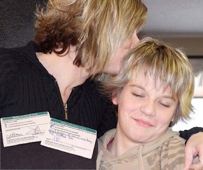 Dixie Hannan plants a kiss on her son Colton (12)