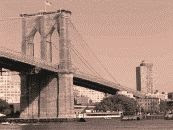 a black and white photograph of the Booklyn Bridge with Brooklyn in the background
