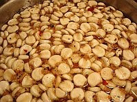 A color photo of nixtamal, dried corn kernels that have been cooked and steeped in an alkaline bath.