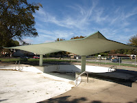 Concrete shade over a public pool in Tulsa.