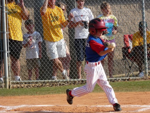 Kaitlin's little brother smacking the crap out of this baseball!