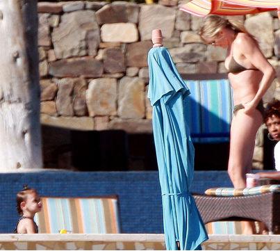 THE FASHION ICON: Cameron Diaz in a skimpy black bikini and white straw