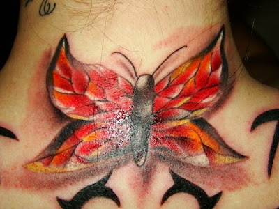 red tribal butterfly back tattoo