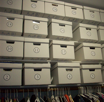closet with numbered bankers boxes