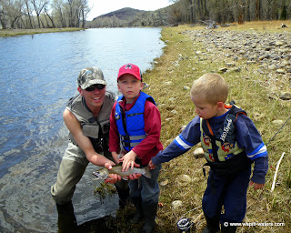 Family fly fishing on the Big Hole River in May