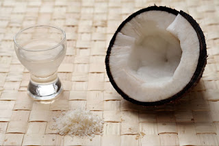 coconut and glass of coconut water