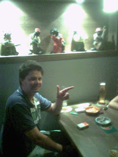 Andy at Garten Bier--note refrigerated wells in table and Negro caricatures