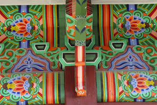 Brilliant colors and designs under the eaves of the King's office/private quarters