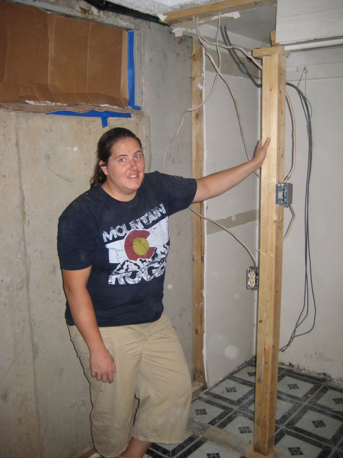 Lisa and Betty Cutting a hole in a perfectly good house...