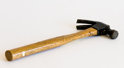 free stock photo of a small wooden handled hammer, copyright J. Gracey Stinson